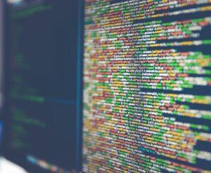 Dual monitors with coding.