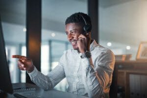 IT support staff on a phone call with client regarding IT managed services.