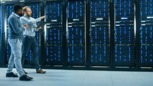 IT employees reviewing hosting servers in an IT environment.