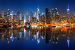 City and bay skyline at night.