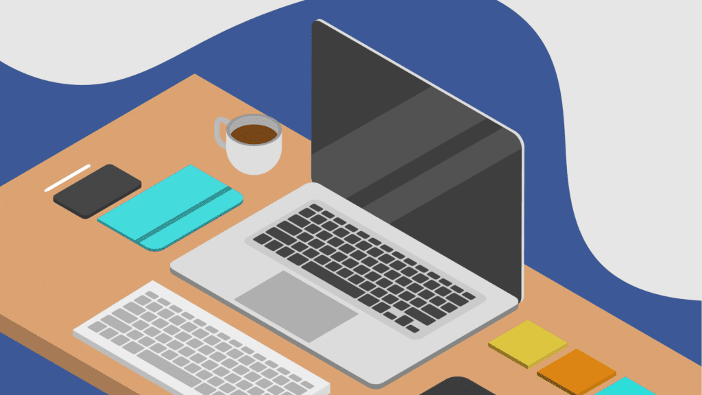 Office desk with laptop, keyboard, tablet and mobile phone.