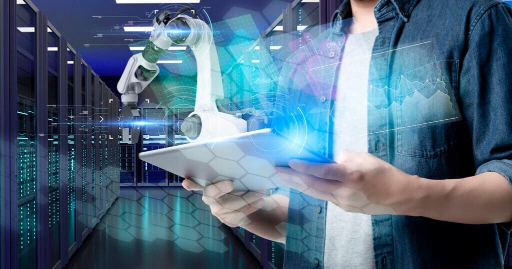 IT employee holding ipad and managing AI robotics equipment.
