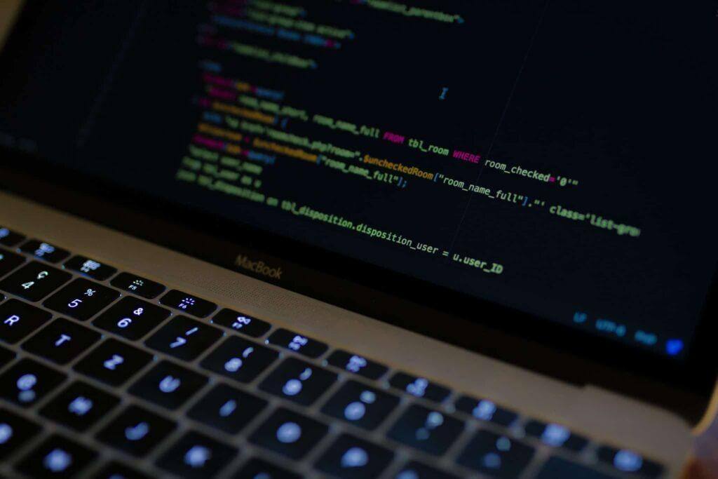 Open laptop with coding in different colors.