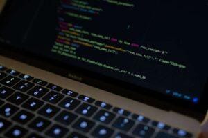 Open laptop with coding in different colors.