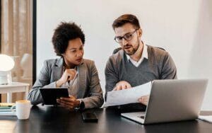 Two business people working on cybersecurity projects