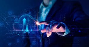 Business man touching clear computer screen display.